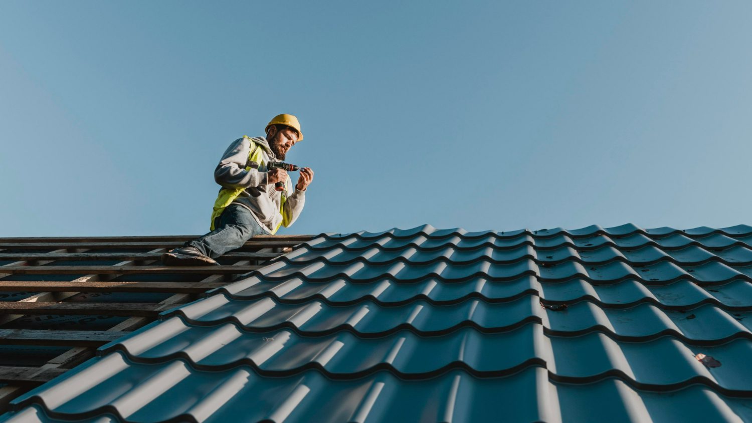 long-shot-man-working-roof top